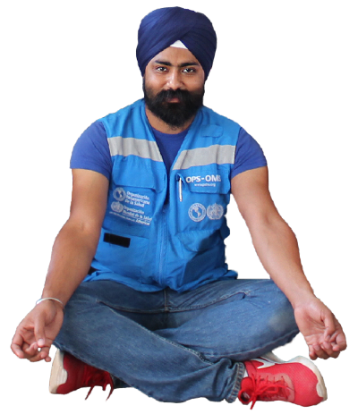 WHO Officer with turban sitting on the floor.